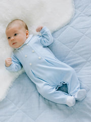 Baby boy wearing the Emile et Rose kasper babygrow.