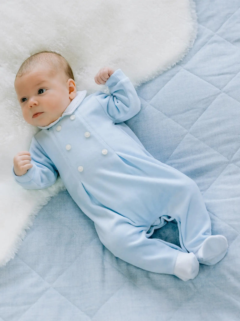 Baby boy wearing the Emile et Rose kasper babygrow.