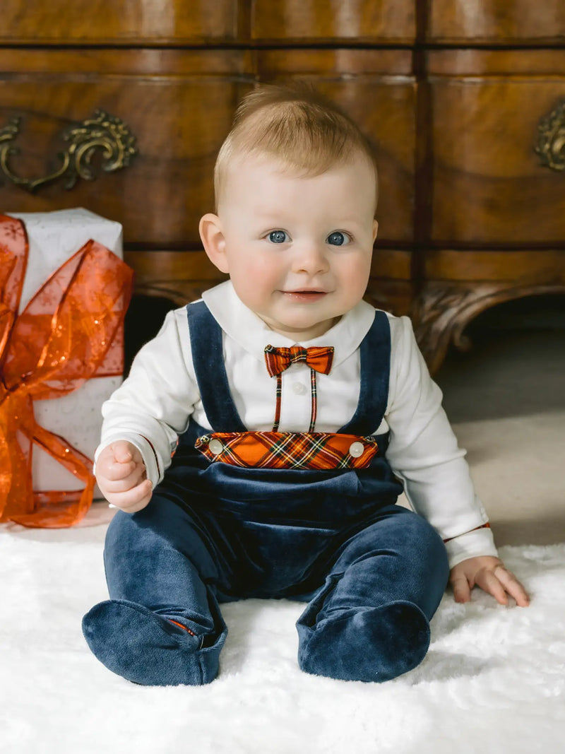 Baby boy modelling the Emile et Rose kenneth babygrow.