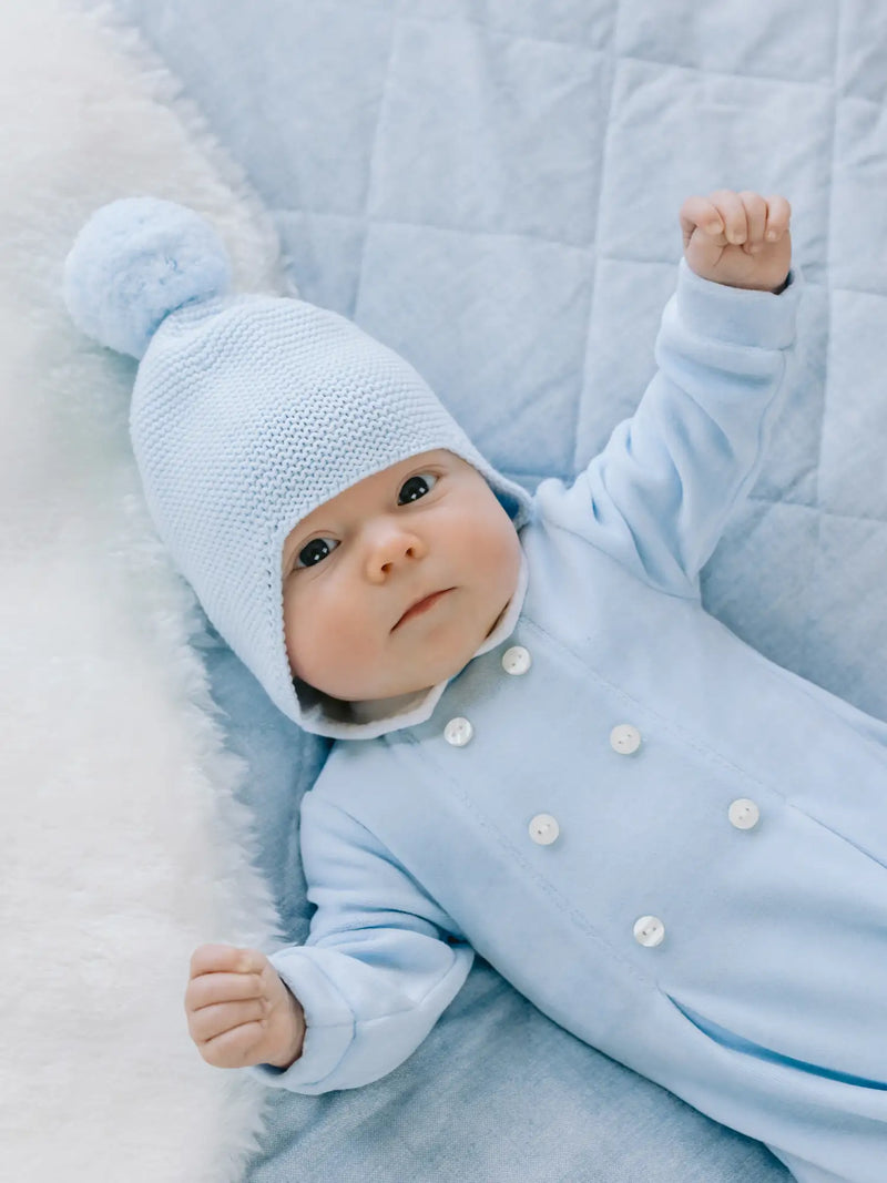Baby boy wearing the Emile et Rose kenton bobble hat.