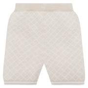 Beige knitted shorts with white diamond pattern.