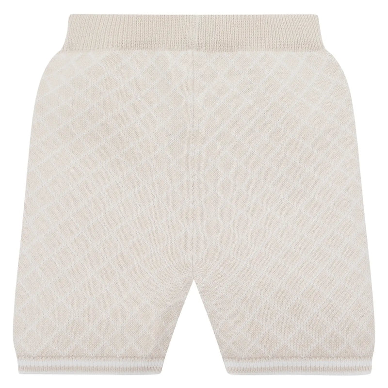 Beige knitted shorts with white diamond pattern.