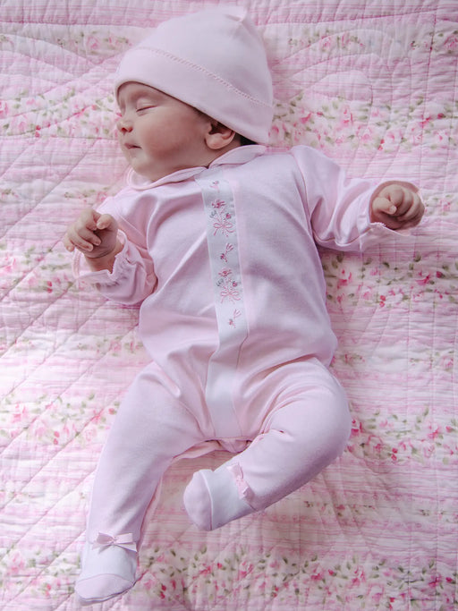Sleeping baby girl wearing the Emile et Rose loretta babygrow.