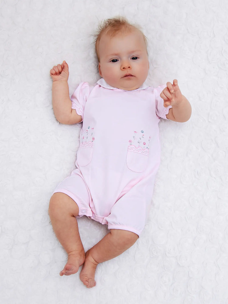Baby girl wearing the Emile et Rose louise romper.