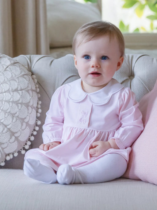Baby girl modelling the Emile et Rose maggie dress.