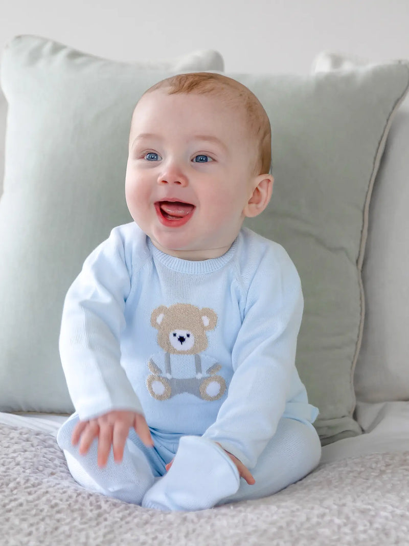 Smiling baby boy modelling the Emile et Rose marco leg warmer set.