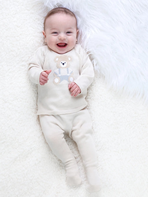 Smiling baby boy modelling the Emile et Rose marco leg warmer set.