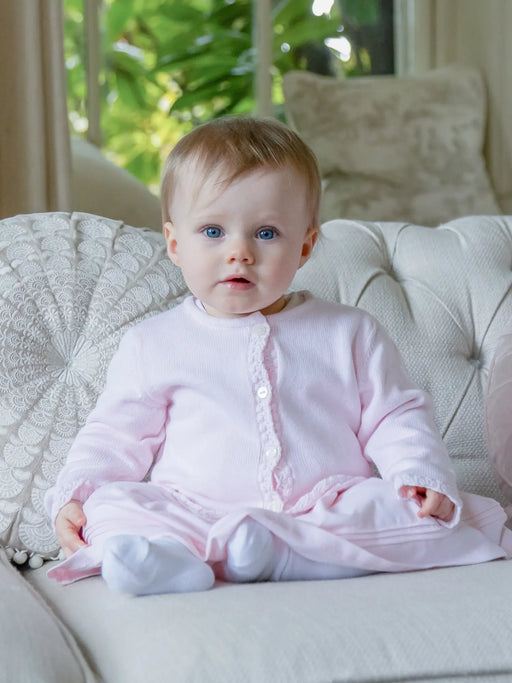 Baby girl wearing the Emile et Rose margot knitted cardigan.