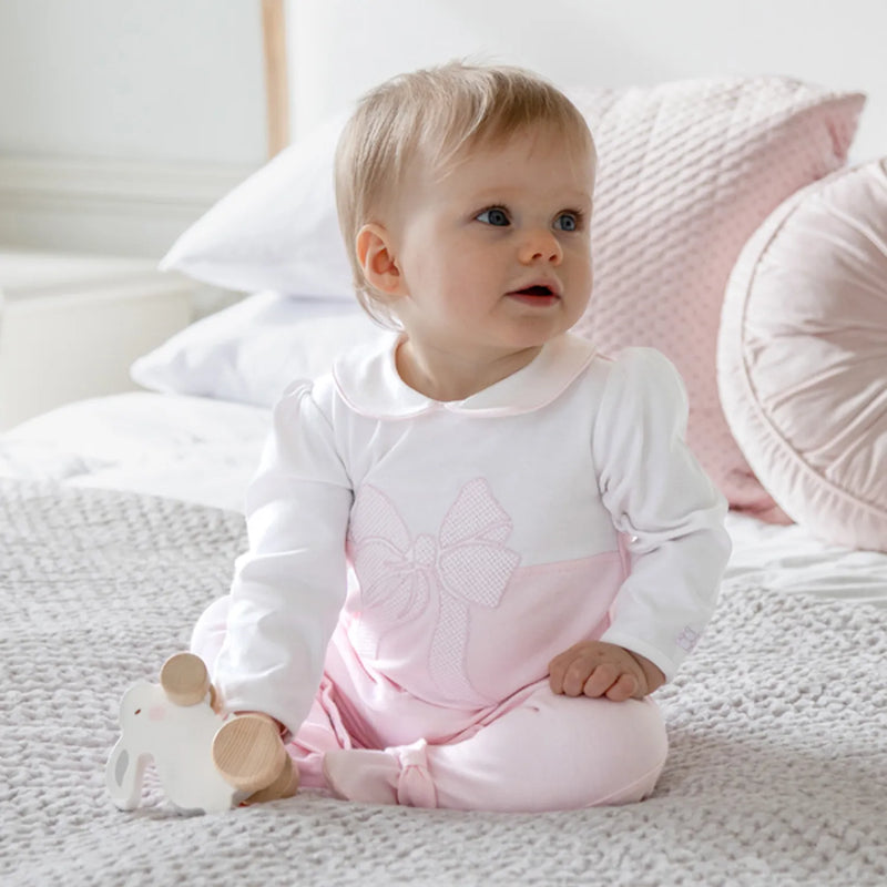 Baby girl modelling the Emile et Rose maya babygrow.