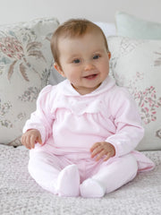 Baby girl wearing the Emile et Rose michelle leg warmer set.