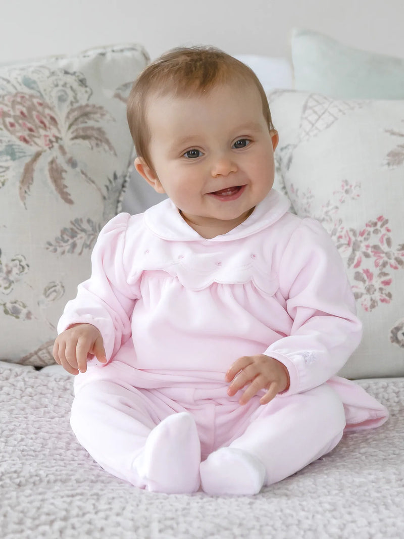 Baby girl wearing the Emile et Rose michelle leg warmer set.
