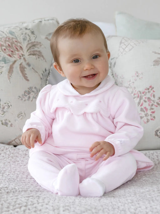 Baby girl wearing the Emile et Rose michelle leg warmer set.