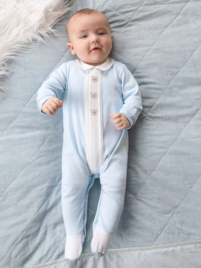 Baby boy modelling the Emile et Rose miles babygrow.