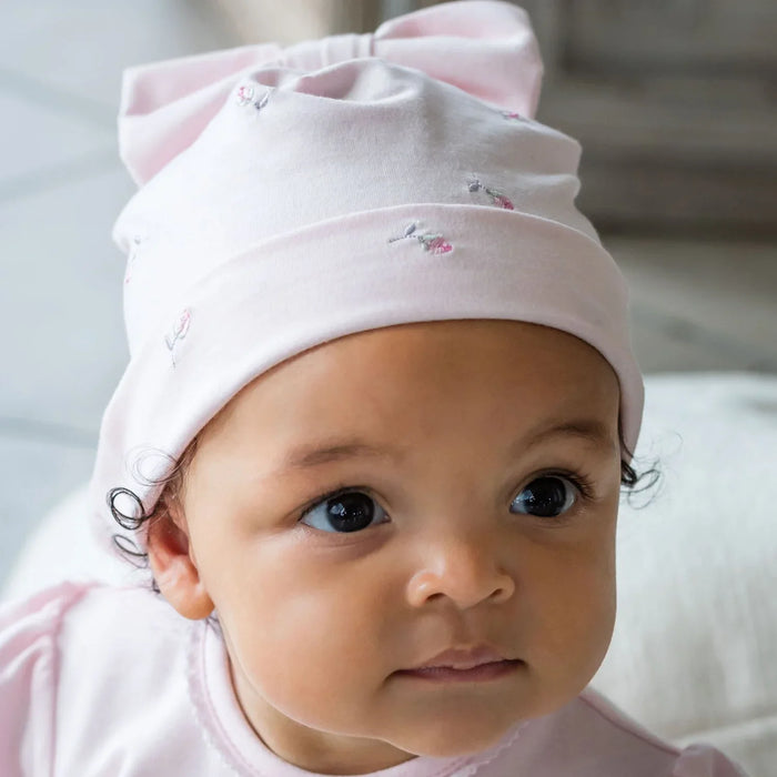 Girl wearing the Emile et Rose winslet bow hat.