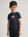 Smiling boy wearing the Gant Archive Shield T-Shirt.