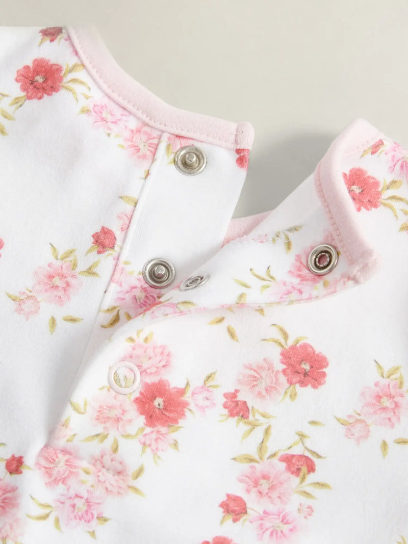 Closer look at the GANT floral print babygrow showing detail of the delicate pink floral print.