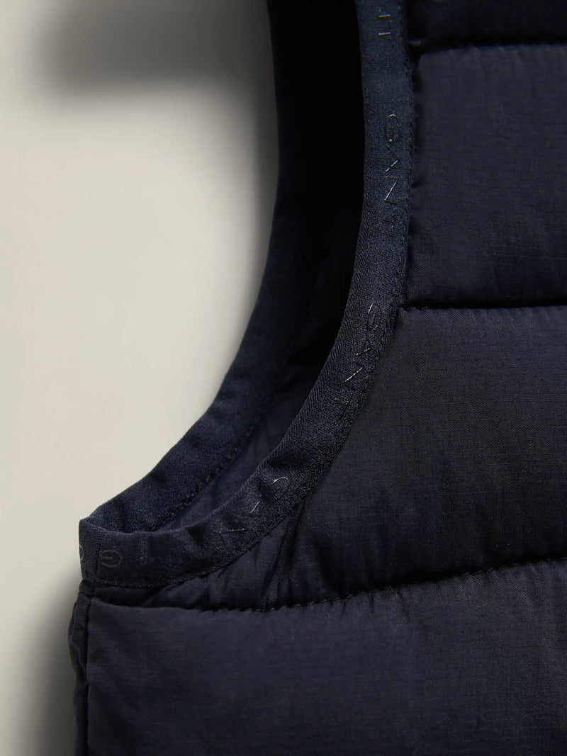 Boy wearing the GANT gilet.