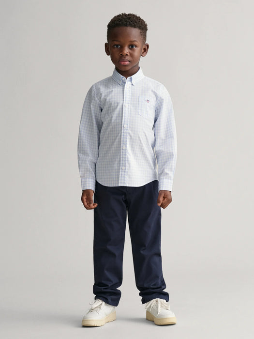 Boy modelling the GANT gingham shirt.