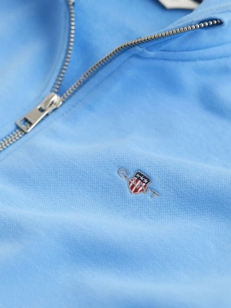 Closer view of the GANT half zip sweatshirt.