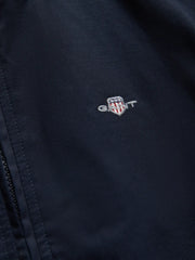 Closer look at the navy GANT harrington jacket.