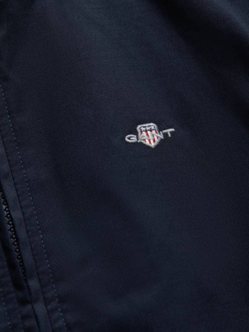 Closer look at the navy GANT harrington jacket.