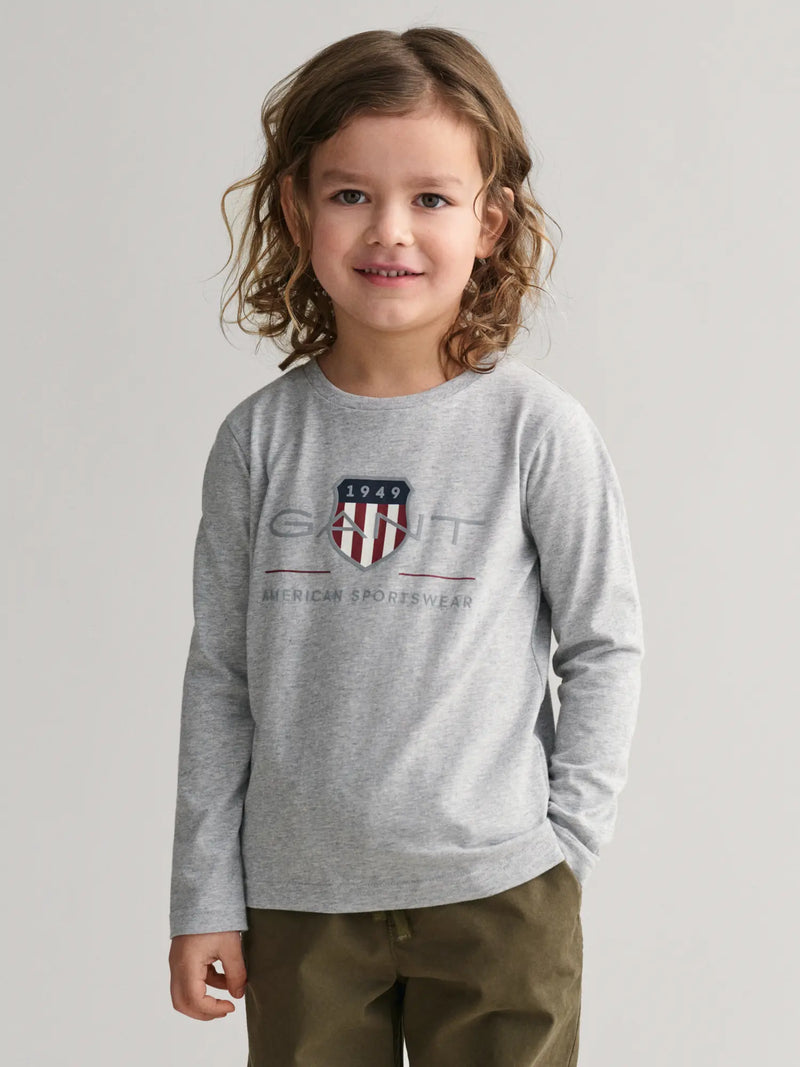 Boy wearing the GANT l/s archive shield t-shirt.