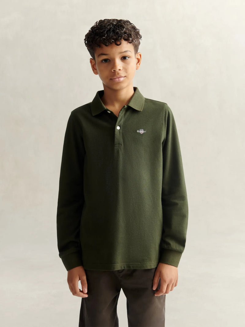 Boy in green long sleeve polo shirt by GANT.