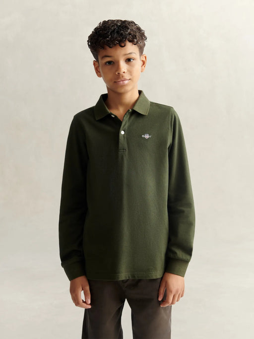 Boy in green long sleeve polo shirt by GANT.