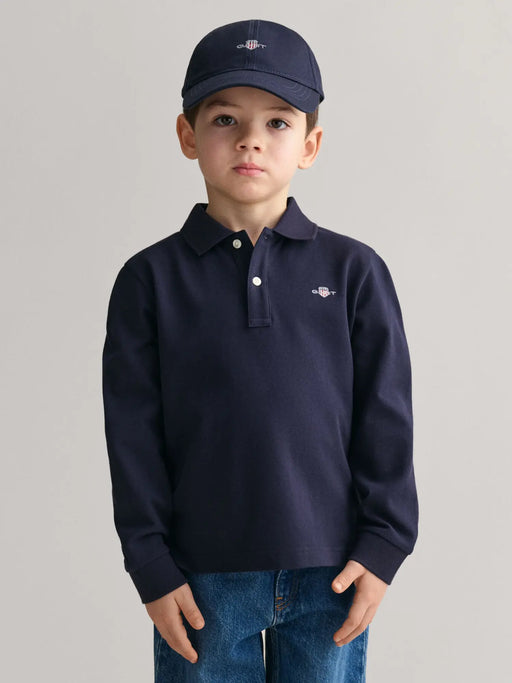 Boy modelling the GANT long sleeve rugby shirt.