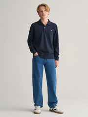 Boy modelling the GANT l/s rugby shirt.