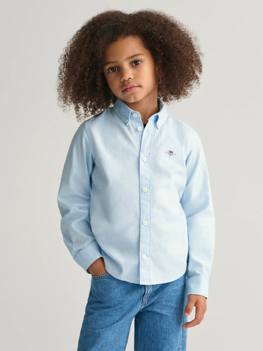 Boy modelling the GANT oxford shirt.