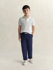 GANT white polo shirt, modelled by boy.