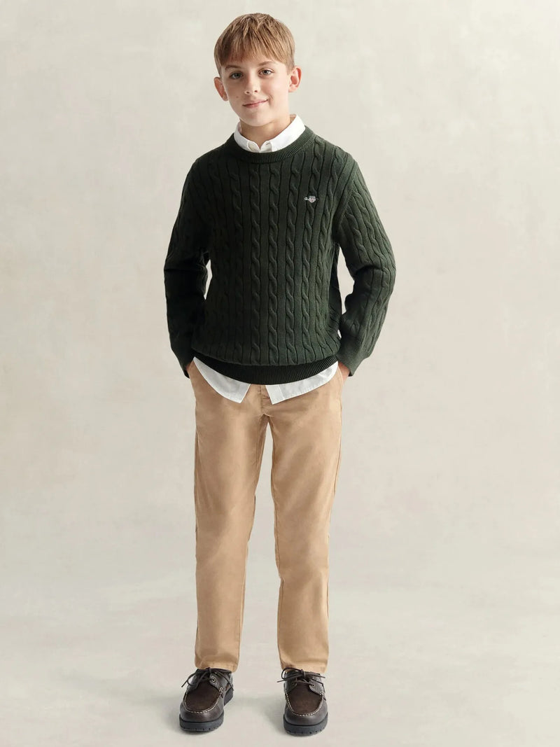 Boy in green shield sweater by GANT.