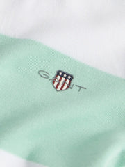 Closer look at the GANT striped romper showing detail of the shield logo on the chest.