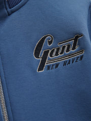 Closer look at the GANT zip up sweatshirt showing detail of the embroidered New Haven logo.