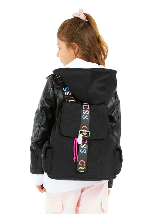 Girl modelling the Guess backpack.