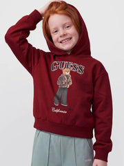 Smiling Girl modelling the Guess bear hoodie.