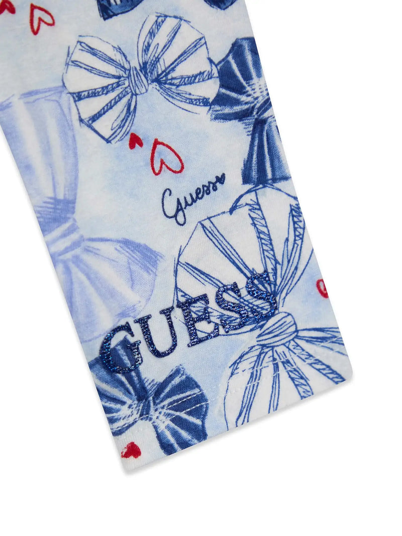 Closer look at the Guess bow leggings showing detail of the blue glitter logo at the ankle.