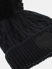 Closer look at the Guess cable knit bobble hat.