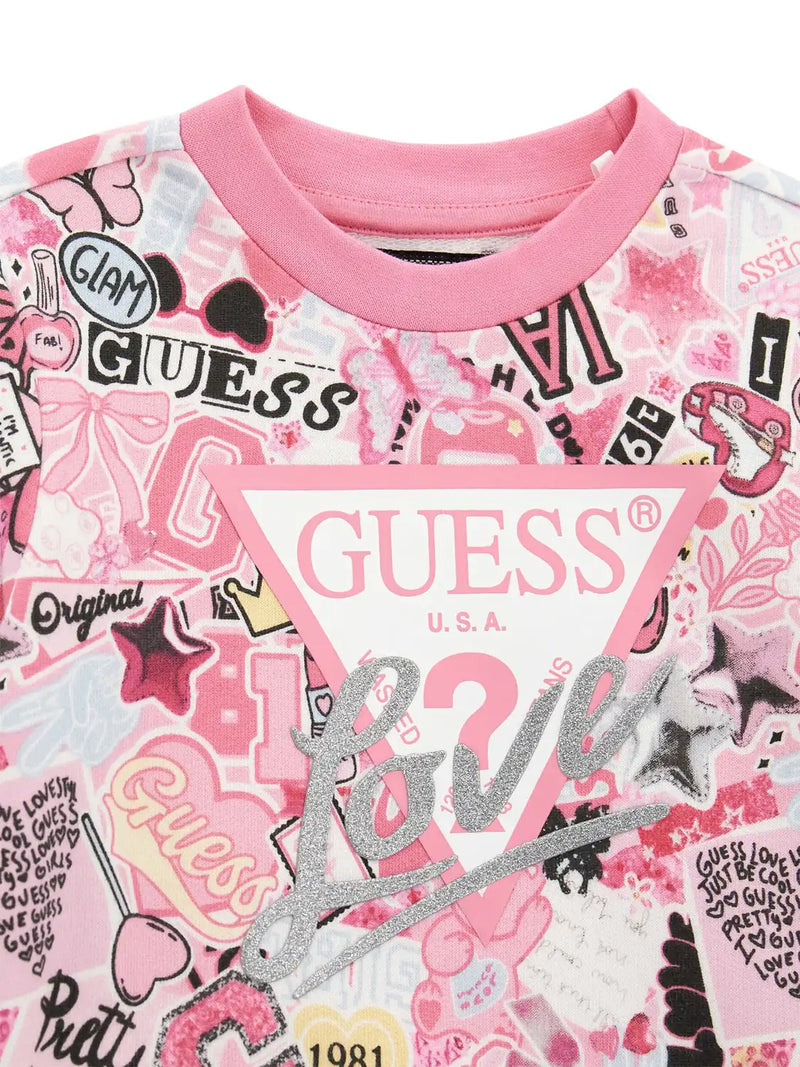 Closer look at the Guess collage print sweatshirt showing detail of the silver glitter logo.