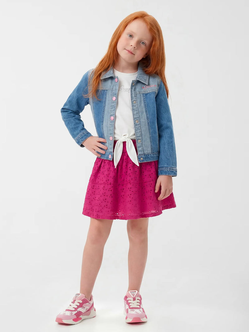 Girl modelling the Guess denim jacket.