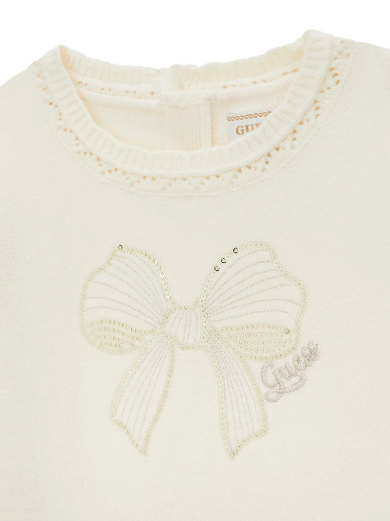Closer look at the Guess dress showing detail of the sequin bow design on the chest.