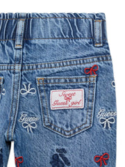 Closer view of the Guess embroidered jeans.