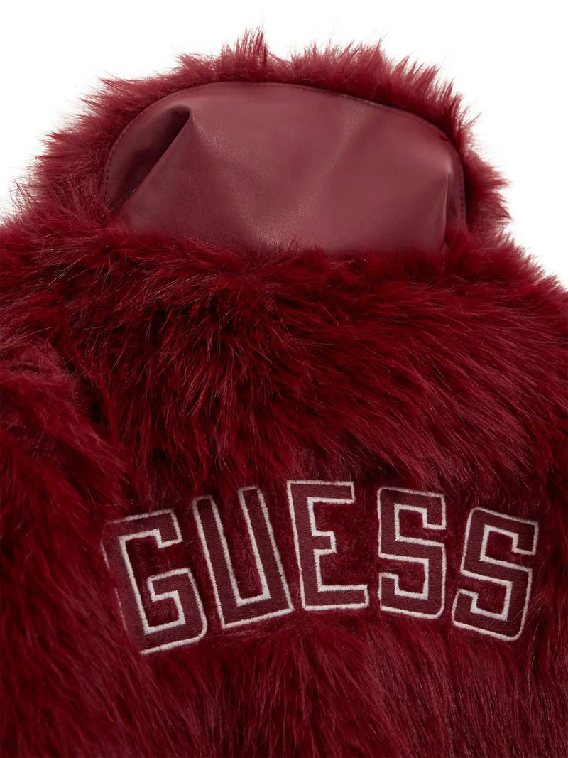 Closer look at the Guess faux fur jacket showing detail of the large embroidered logo.
