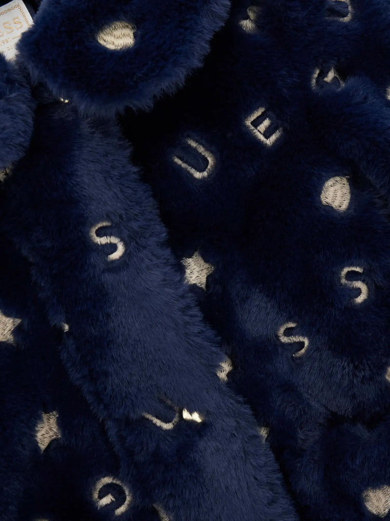 Closer look at the Guess faux fur jacket showing detail of the gold embroidered pattern.