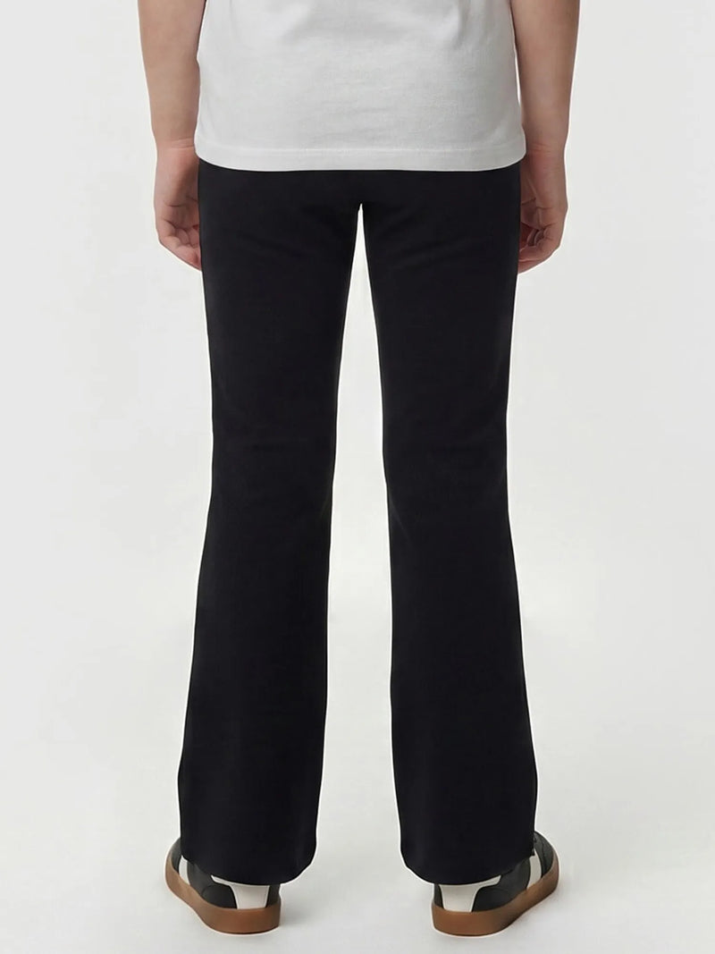 Rear view of the Guess flared leggings.