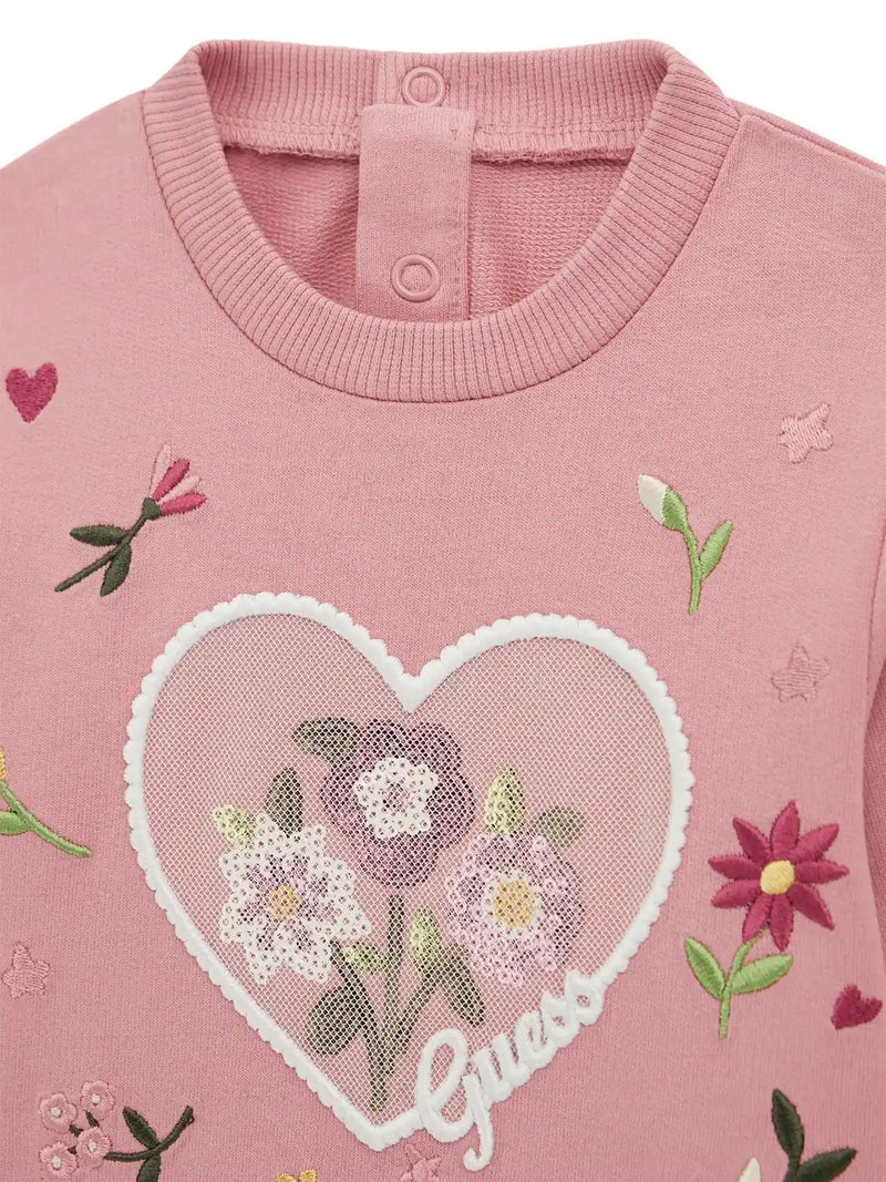 Closer look at the detail of the heart logo patch.