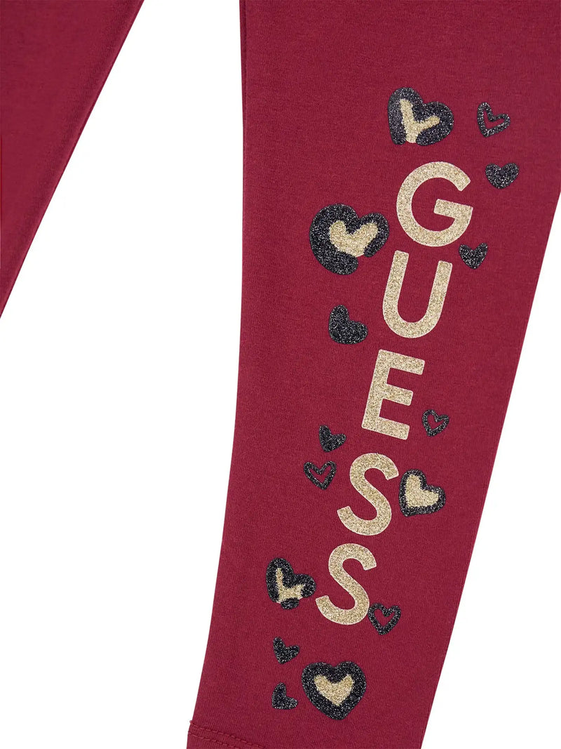 Closer look at the Guess glitter logo leggings showing detail of the black and gold glitter logo.