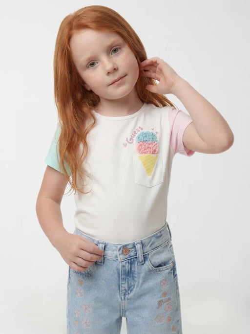 Smiling Girl modelling the Guess ice cream t-shirt.