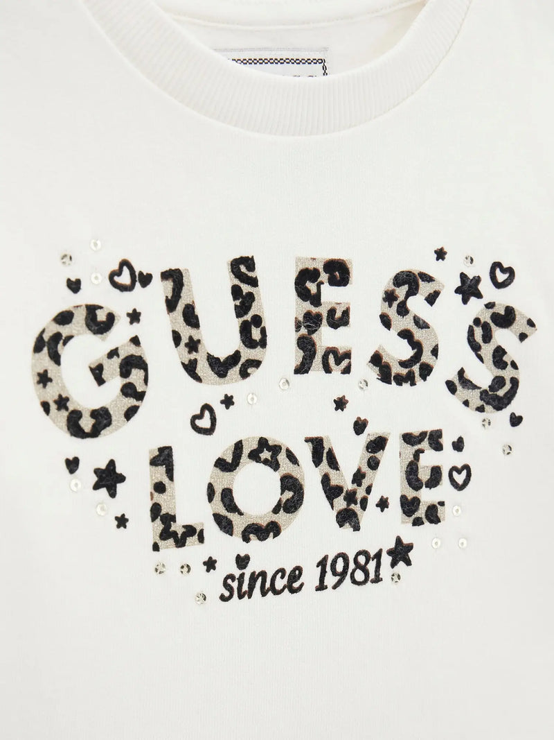 Closer look at the Guess leopard print leggings set showing detail of the leopard print logo.